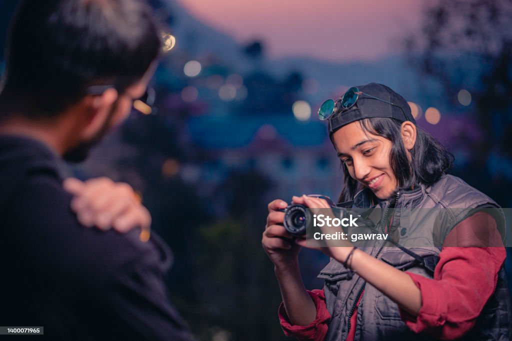 Young Female Photographer On Shoot With A Male Model Stock Photo