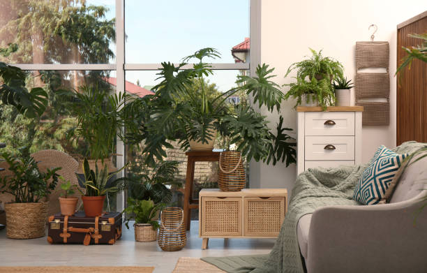 istock Stylish living room with beautiful plants. Interior design 1400072350
