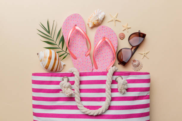 istock beach accessories flat lay top view on colored background Summer travel concept. Bag with starfish and sea shell. Top view 1400073559