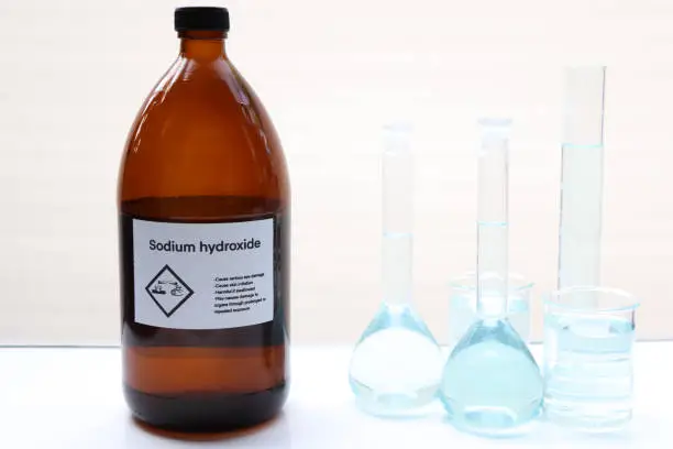 Photo of Sodium hydroxide in bottle, chemical in the laboratory