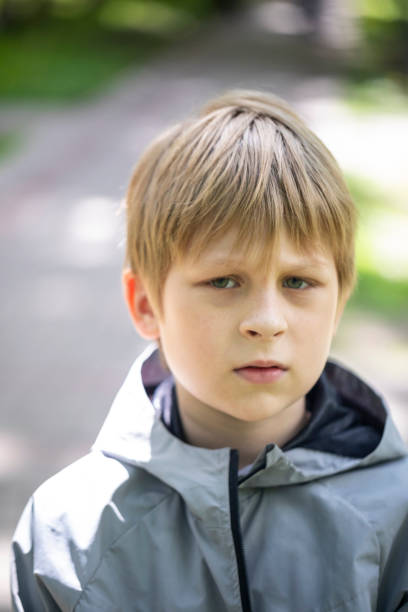 istock Serious little boy looking at the camera 1400074242