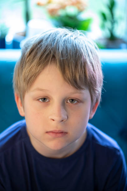 istock Serious little boy looking at the camera 1400074265