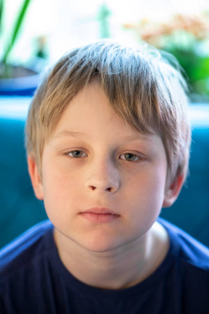 istock Serious little boy looking at the camera 1400074272