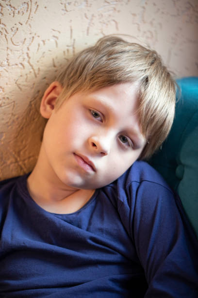 istock Serious little boy looking at the camera 1400074909