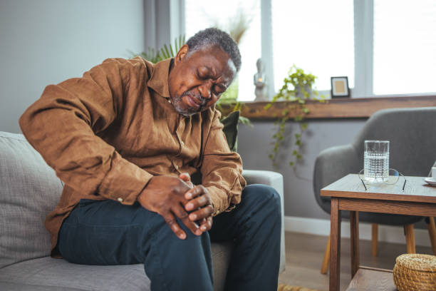 istock A mature man massages his aching knee. 1400075001