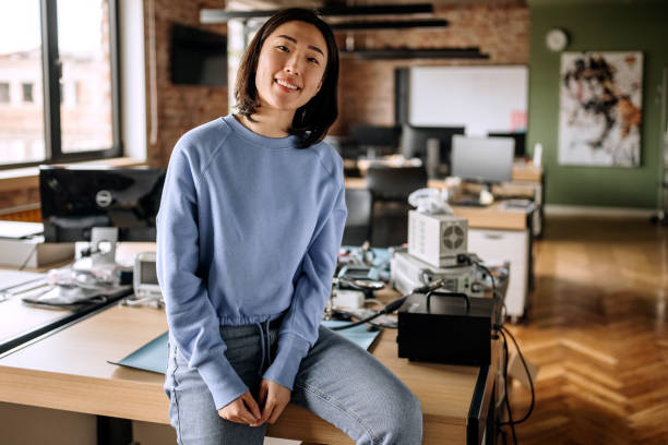 istock Young woman posing in the office 1400075190