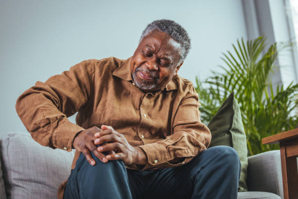 istock Mature man massaging his painful knee. 1400075220