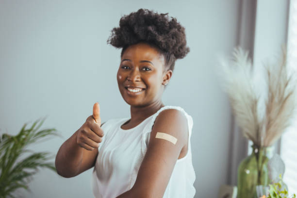 istock Cheerful vaccinated black woman 1400075379