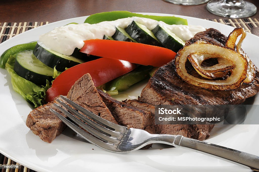 Steak and salad A sliced sirloin steak and fresh vegetables Beef Stock Photo