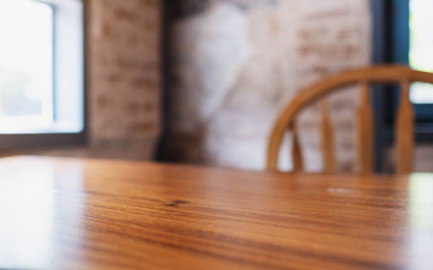 istock Wooden table and chairs in the room with blurred background 1400078252