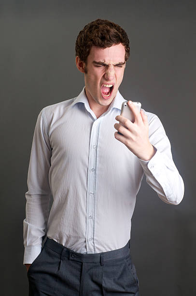 istock Angry man on phone 140008014