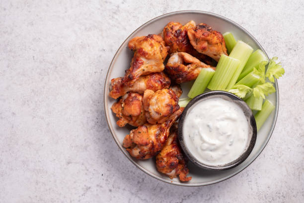 istock buffalo chicken wings with celery and beer 1400081864