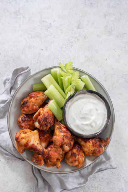 istock buffalo chicken wings with celery and beer 1400081866