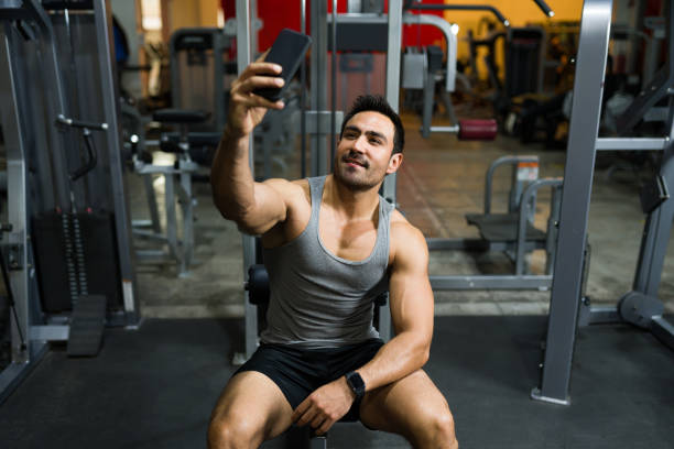 istock Young man taking a picture at the gym 1400082076