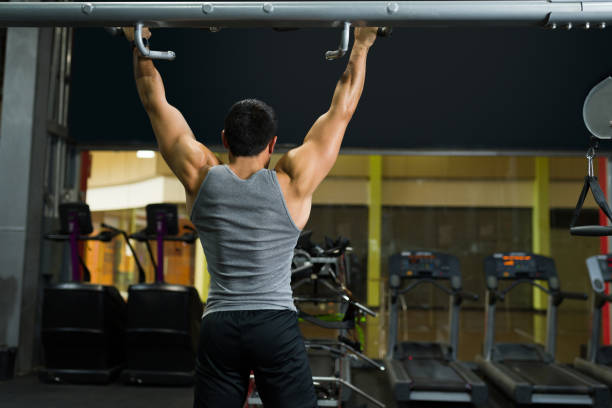 istock Rear view of a muscular man exercising 1400082124