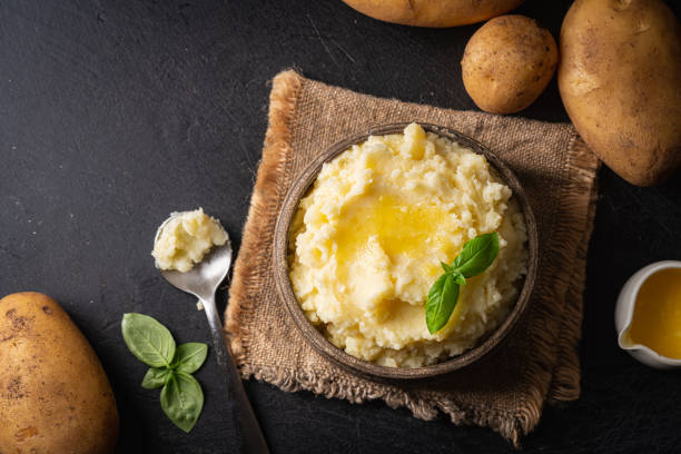 Mashed potatoes in bowl Mashed potatoes in ceramic bowl on wooden rustic table, top view. Healthy food mash food state stock pictures, royalty-free photos & images