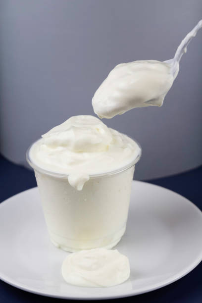 istock Greek yoghurt in clear cup,white and creamy texture, 1400083320