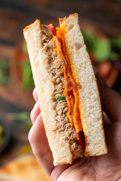 istock Homemade tuna melt sandwich on rustic board 1400083351