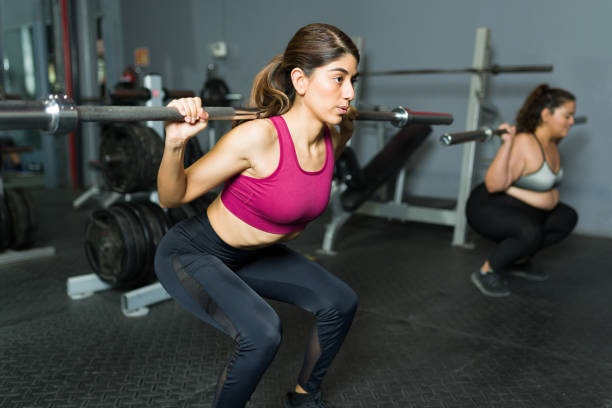 istock Beautiful trainer coaching an overweight woman 1400083868