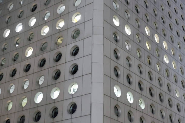 Architecturl details of Jardine House, an office tower who was after its completion in 1972, the tallest building in Hong Kong and in Asia at 178 mt height.