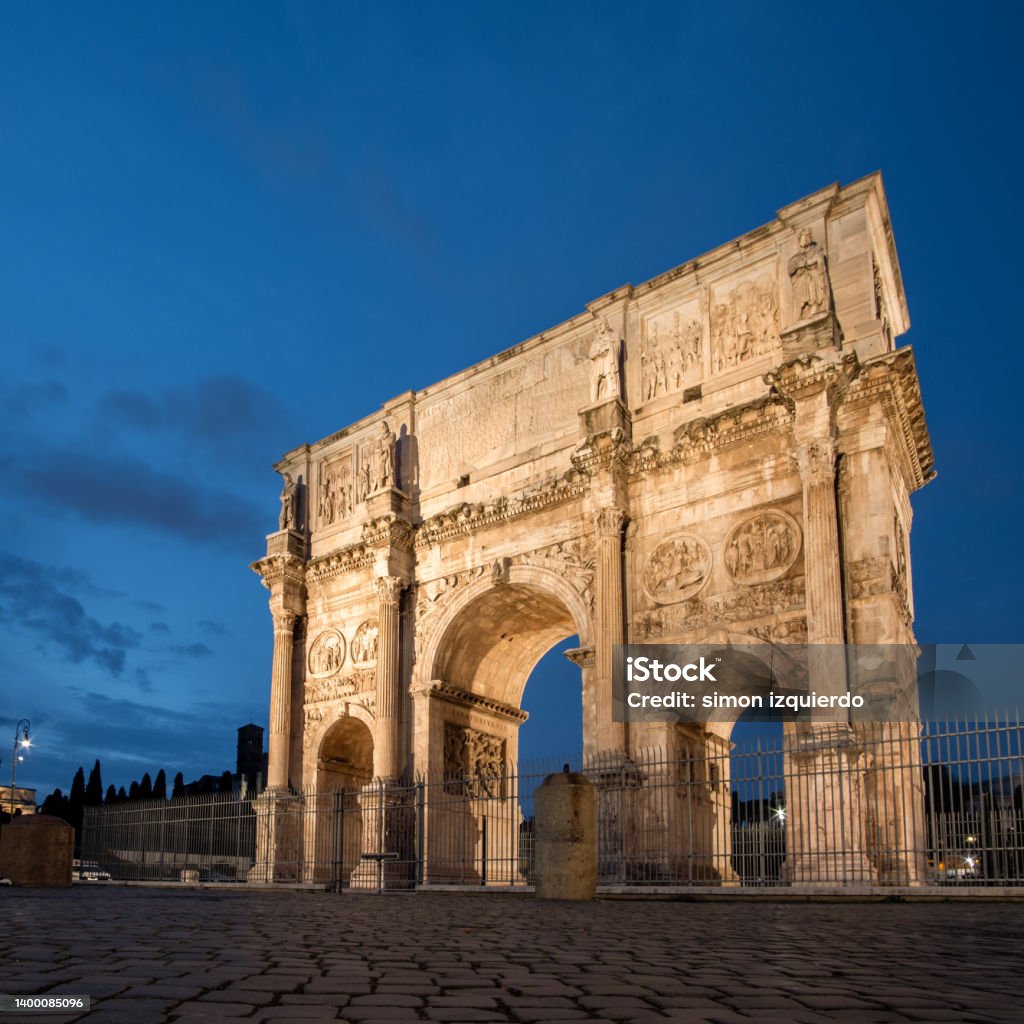 The Arch of Titus at blue hour in Roman Forum, Rome Ancient Stock Photo