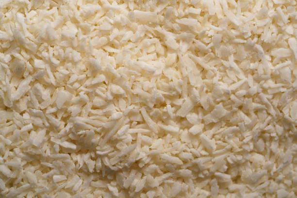 istock Coconut flakes.Shredded coconut. high magnification close up. Background, texture 1400085263