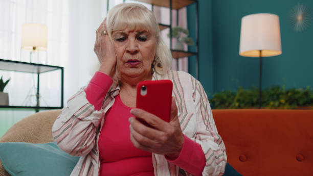 istock Sad senior granfather use mobile smartphone loses becoming surprised sudden bad lottery results news 1400085631