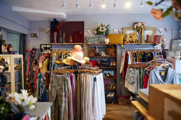 Interior Of Charity Shop Or Thrift Store Selling Used And Sustainable Clothing And Household Goods Interior Of Charity Shop Or Thrift Store Selling Used And Sustainable Clothing And Household Goods second hand stock pictures, royalty-free photos & images