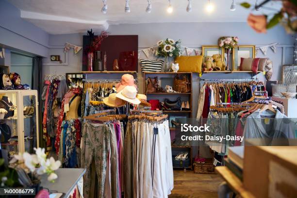 Interior Of Charity Shop Or Thrift Store Selling Used And Sustainable Clothing And Household Goods Stock Photo - Download Image Now