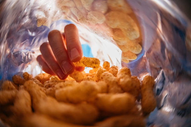 istock Young Man Eating Flips From The Bag's POV 1400088560