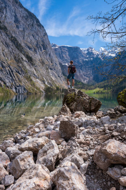 istock Enjoying the view on the mountains from a boulder at Obersee 1400089300