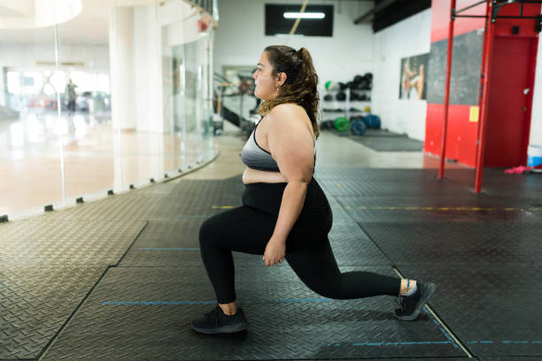 istock Young fat woman working out 1400090133