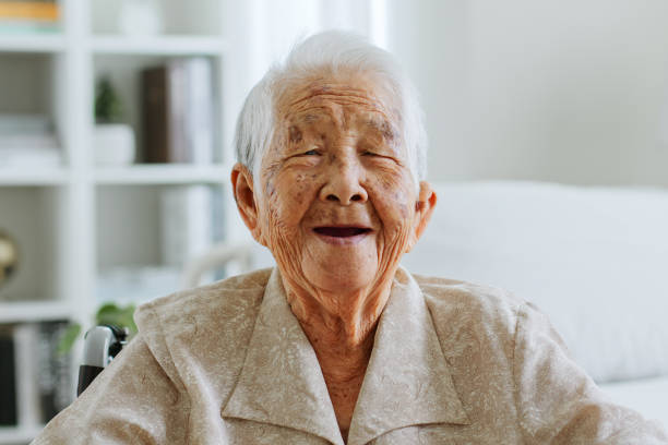Portrait happy Asian senior woman 90s look at camera, smile and laugh at nursing home Portrait happy Asian senior woman 90s look at camera, smile and laugh at nursing home 90 plus years photos stock pictures, royalty-free photos & images