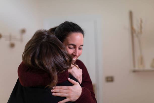 istock Two friends, patient and therapist hug each other 1400092161