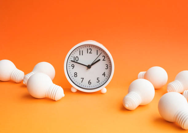 istock Time,dateline and creativity concepts with group of lightbulb and clock on pastel color 1400094403