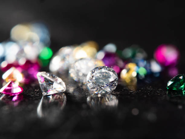 istock Close up shot of group multi colors diamond on a black background 1400095064