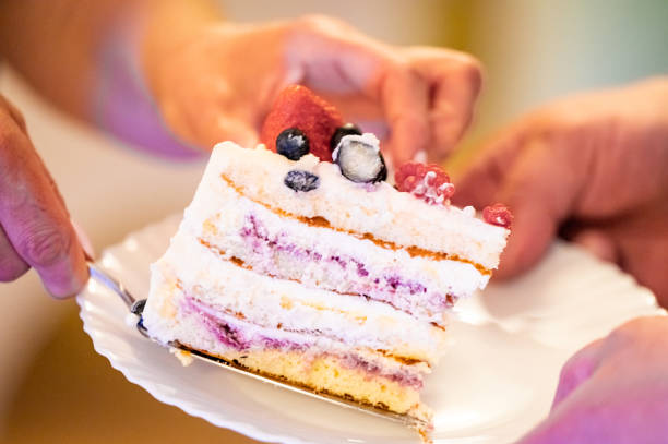 istock woman cutting cake 1400096179