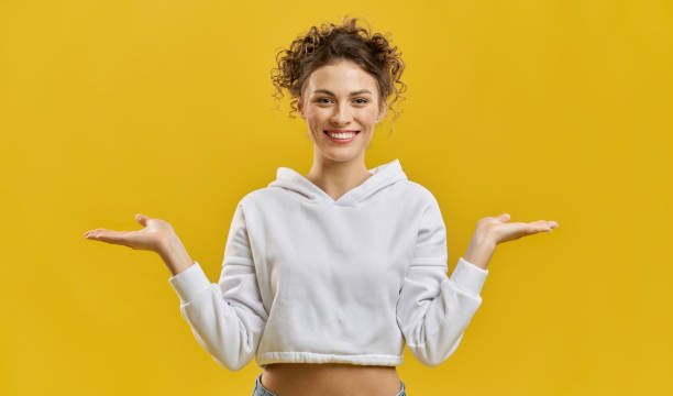 istock Pretty model with curly hair posing, smiling. 1400097279