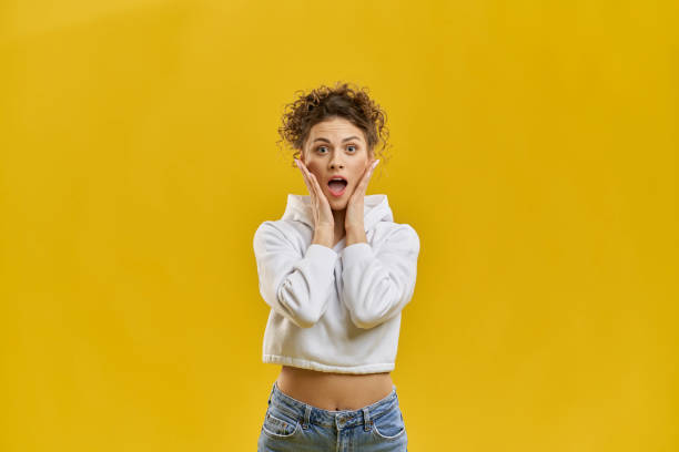 istock Pretty girl posing, shocked, surprised. 1400097402