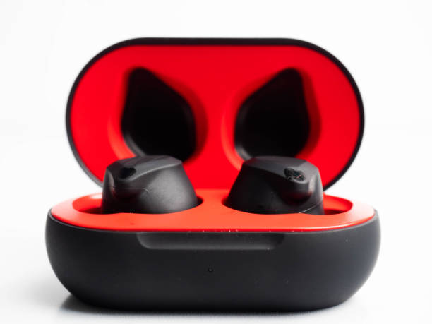 a pair of black wireless earphone with case - cotton swab audio imagens e fotografias de stock