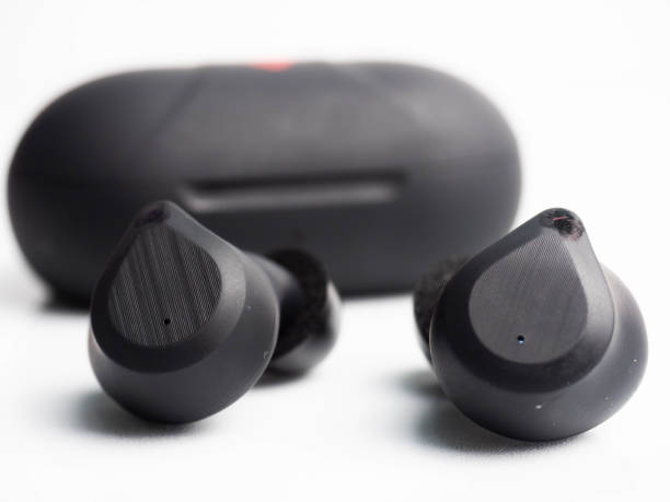 a pair of black wireless earphone with case - cotton swab audio imagens e fotografias de stock