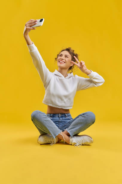 istock Pretty girl taking selfie from above. 1400098261