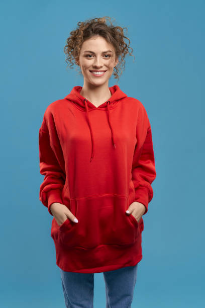 istock Pretty young woman standing, smiling. 1400098294