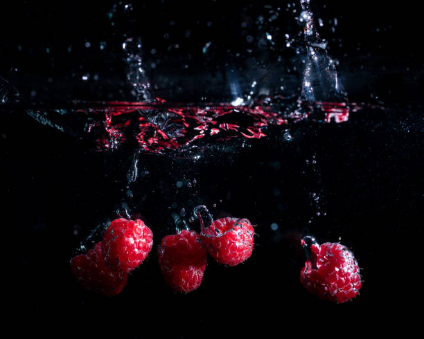 Raspberries fall into the water