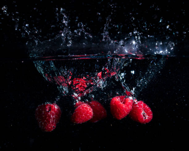 Raspberries fall into the water