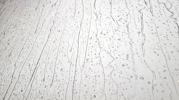 istock background raindrops on the clear window. a small raindrop rests on the glass after rain. 1400098609