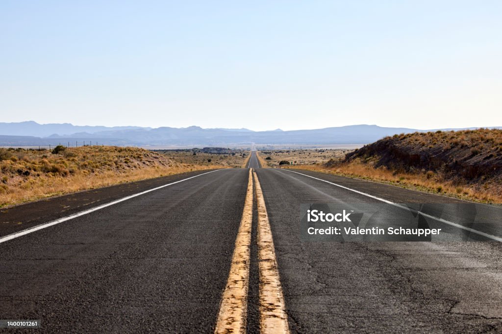 American Road with 2 yellow lines no passing Road Stock Photo