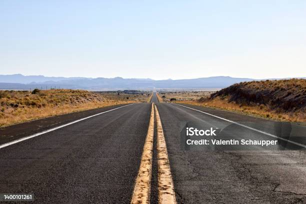 American Road With 2 Yellow Lines No Passing Stock Photo - Download Image Now - Road, Long, Straight