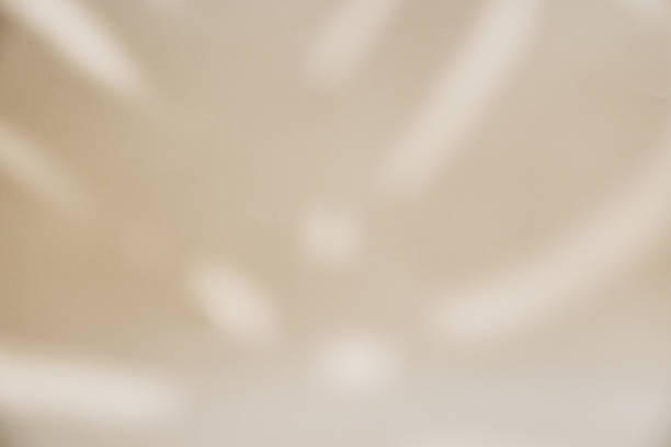 istock Shadow of palm leaf on pastel background 1400102379