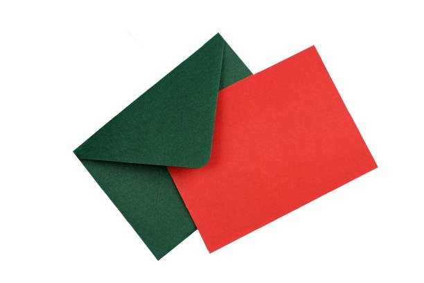 istock A green envelope with a red sheet for writing text lies on a white background. 1400102472
